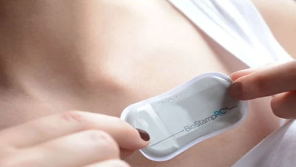 Wearable device on woman's chest