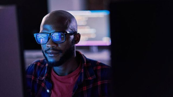 a man's face fragmented in an abstract digital interface