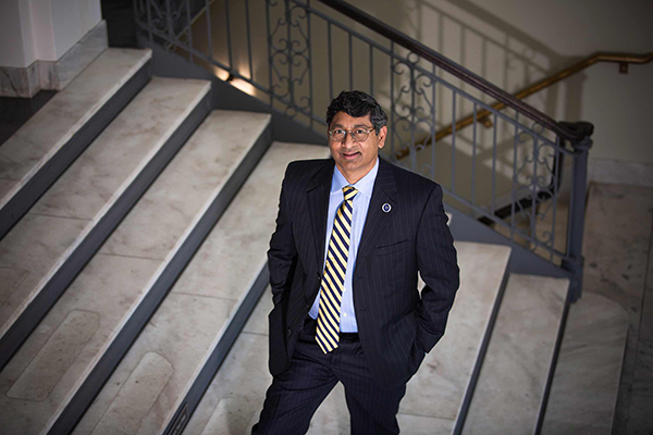 picture of provost ravi bellamkonda standing on a stairway