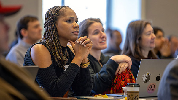 Attendees at conference listen to speaker