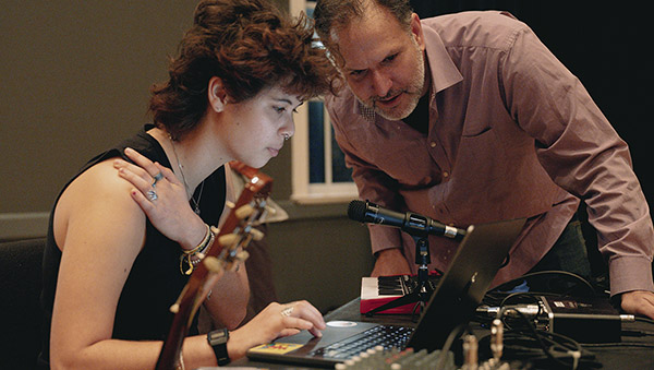 Student and professor view laptop